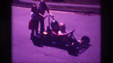 San Diego B USA-1981: Mom With 3 Kids Two Girls And One Boy Playing In Go-Kart