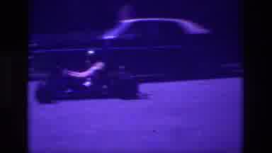 San Diego B USA (1981): Boy In Helmet Riding Go-Kart Up And Down Residential