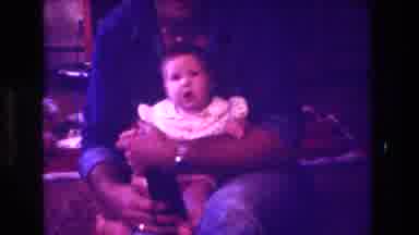 San Diego C USA (1981): Baby In Man's Arms Is Amazed At The Camera