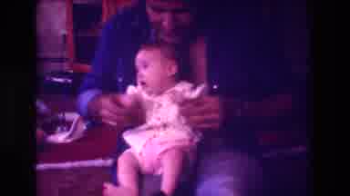 San Diego C USA (1981): Father Clapping With His Baby Daughter In His Lap While