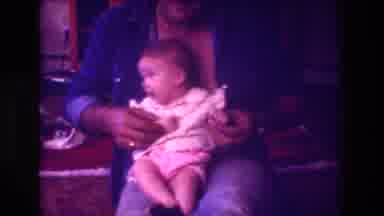 San Diego C USA (1981): Baby Sitting On Mans Lap Man Playing With Hands