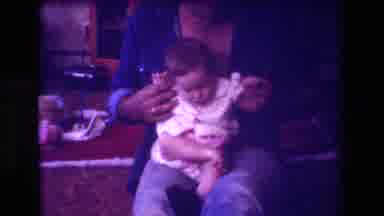 San Diego C USA (1981): A Man And A Baby On Floor Interact Playfully In Home