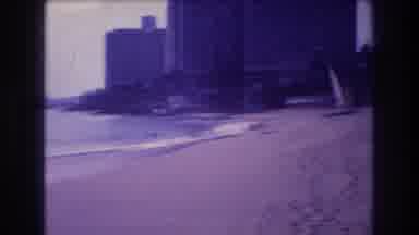 Acapulco Mexico (1982): The Waves Roll Onto The Sandy Beach Next To A Tall Hotel