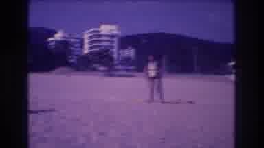 Acapulco Mexico (1982): Person Standing On A Beach With Hotels And Hills In The