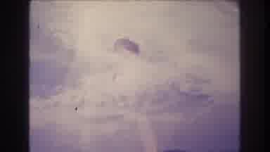 Acapulco Mexico (1982): Skydiver Flies Over Water With A Parachute On A Sunny Day