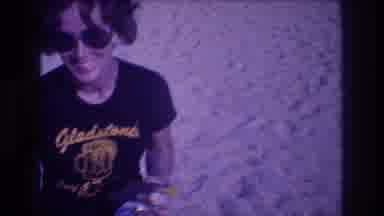 Acapulco Mexico (1982): A Woman Standing On The Beach Wearing Sunglasses And A