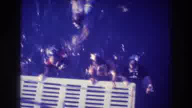 Acapulco Mexico (1982): Divers Swimming In Ocean Hanging On To Structural