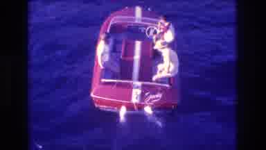 Acapulco Mexico (1982): Three People Riding In A Red Boat In Calm Waters
