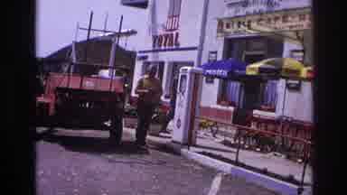 France (1967): Old Man In Yellow Shirt Walking And Reading Near Gas Station