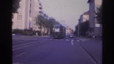 France (1967): Trolly Car Driving Down City Street