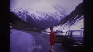 France (1967): Woman In Red Next To A Parked Car, Camera Pans To Mountains Half