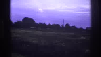 France (1967): Wind Blowing Over Grass Sparse Trees And Road Near House