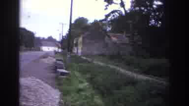 France (1967): Desolate Eastern European Town With Guest Visiting A Memorial Grave