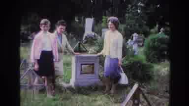 France (1967): Three Older Ladies Standing Around A Tombstone In A Cemetery