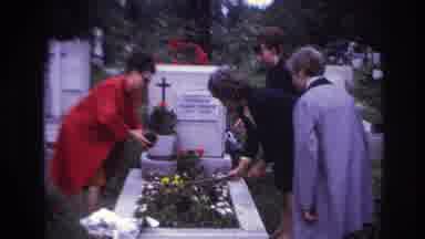 France (1967): Family Putting Flowers At Someones Gravestone During A Funeral