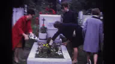 France (1967): Women Tending To The Flowers On A Raised Grave Site Trying To Make