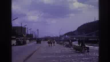 France (1967): Road Beside The River With A Bridge And People Passing By