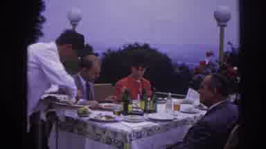 France (1967): Well Dressed Group Eating Lunch On A Balcony Of A Restaurant