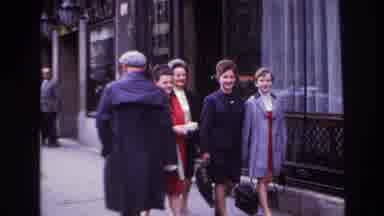 France (1967): Four Well-Dressed Ladies In Coats Walking Down A Busy Sidewalk