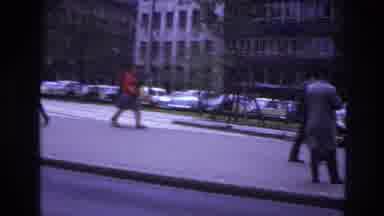 France (1967): People Walking On The Sidewalk With Huge Buildings Behind And Cars