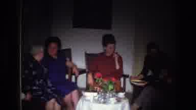 France (1967): Group Of Women Chat During A Get Together, There Are Flowers On The