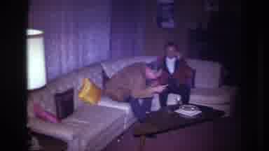 Ottawa Canada (1967): Two Men Conversing On A Curved Couch As A Woman In A Red
