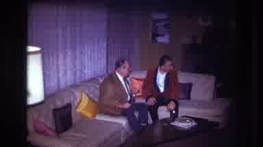 Ottawa Canada (1967): Two Gentlemen Sitting On A Couch Being Approached By A Woman