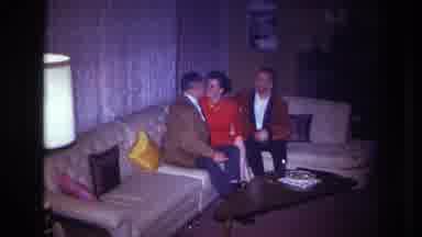 Ottawa Canada (1967): 3 Adults Are Friendly On A Couch Kissing And Cuddling