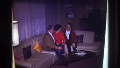 Ottawa Canada (1967): Lady In Red And Two Men Sitting On A Couch Having A