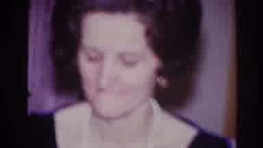 Ottawa Canada (1967): Woman Wearing A Necklace Pursing Lips In Room Beside A Man