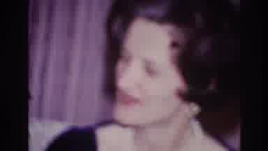 Ottawa Canada (1967): A Woman Wearing Pearls Smiles And Claps Her Hands Together