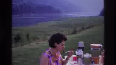 Ottawa Canada (1967): A Woman Eating On A Picnic Bench, And A Mountain Behind Her