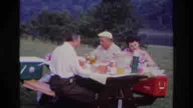 Ottawa Canada (1967): Three People Sit And Enjoy A Large Picnic Lunch Outdoors