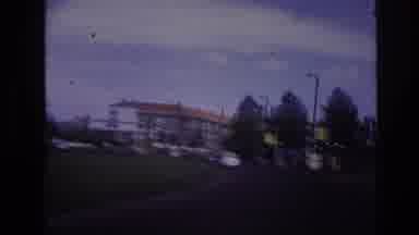 Paris France-1967: Driving Down A Tree-Lined Street With Classic Cars
