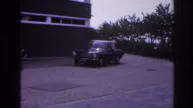 Paris France (1967): A Black Car Beginning The Drive Towards The Road