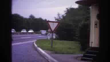 Paris France (1967): Cars Passing Highway Zooming Beside Sign On
