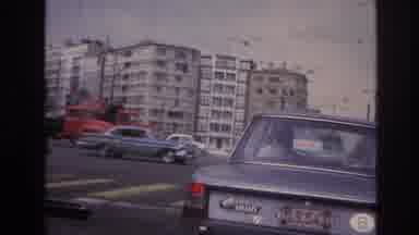Paris France (1967): Man Stopped Inside A Grey Car While Roadworks Happen On The