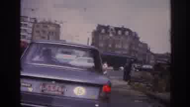 Paris France (1967): The Bustling Big City: Automobiles And People On Foot Racing