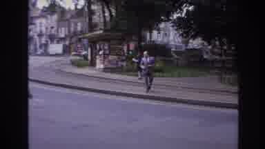 Paris France (1967): Man Tries To Cross The Street But Has To Wait For A Car To Go