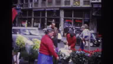 Paris France (1967): A Lady Selling Flowers In The Street While People With