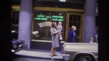 Paris France (1967): Woman In A Long Coat Holding A Child In The Street, Then Cuts