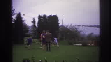 Paris France (1967): Kids Run Around Outside As Adults Stand Talking To One