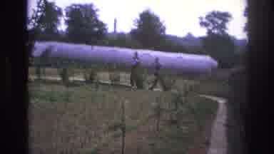 Paris France-1967: Two Men Walking Through Garden Near Greenhouse