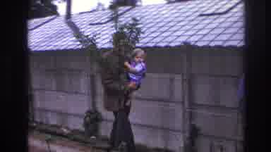 Paris France (1967): A Man Walking Beside A Wall, Having A Conversation With A