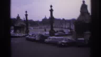Paris France (1967): A Drive Through Systematic Parking Lot With A Tall Tower