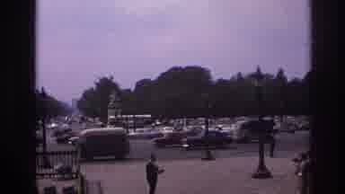 PARIS FRANCE-1967: Bustling City Square With Classic Cars And Maxim's Restaurant