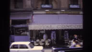 Paris France (1967): Downtown Architecture In Busy City As Cars And People Rush By