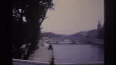 Paris France (1967): Passing Over A Stone Bridge With Lamps Crossing Over A Canal