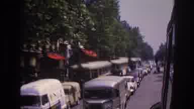 Paris France (1967): A Bus Passing Traffic