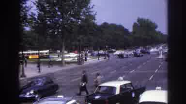 Paris France (1967): People Are Walking Across A Very Busy Street With 5 Lanes Of